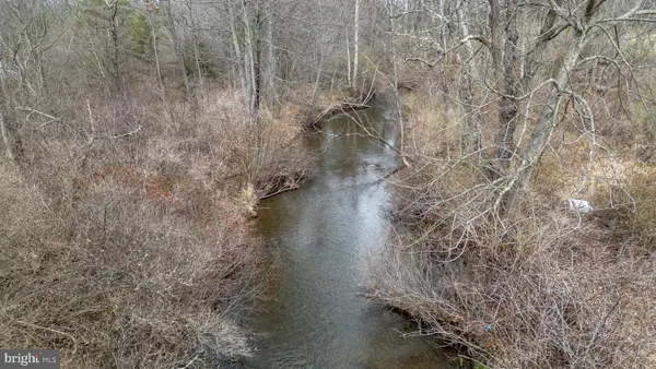 a view of a lake with a yard