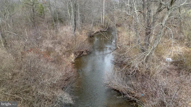 a view of a lake with a yard