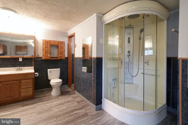 a view of wooden floor in a hall with wooden floor