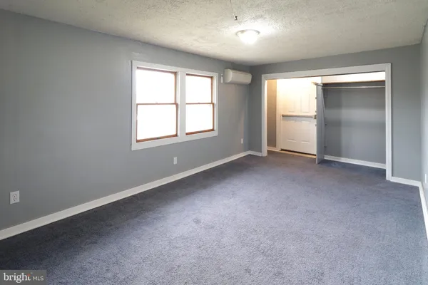 a view of empty room with windows