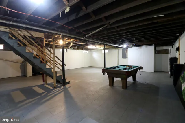 a view of a house with a door and wooden walls