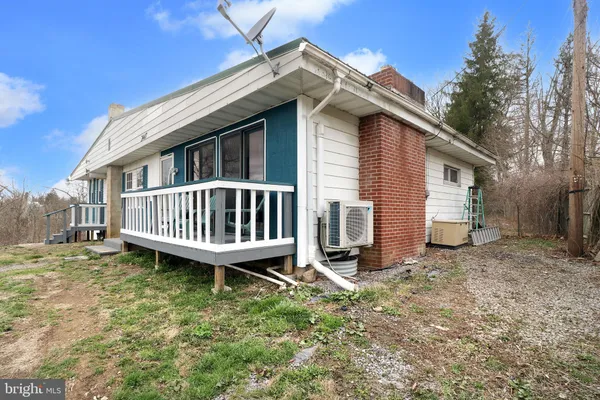 a view of a yard with an outdoor seating