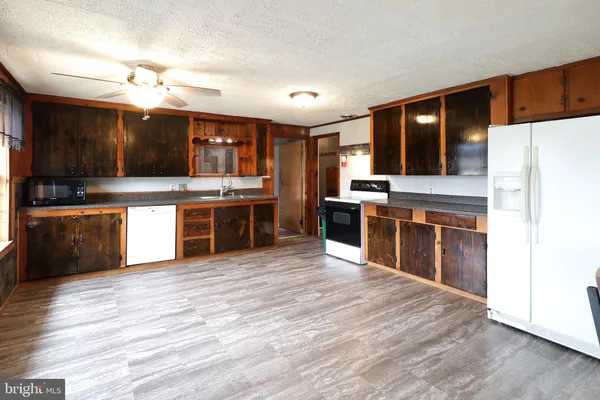 a kitchen that has a sink and a stove