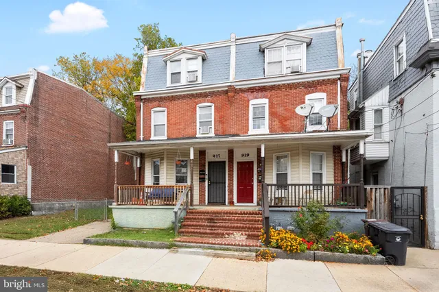 a view of a brick building with many windows