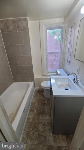 a bathroom with a sink a bathtub and a shower