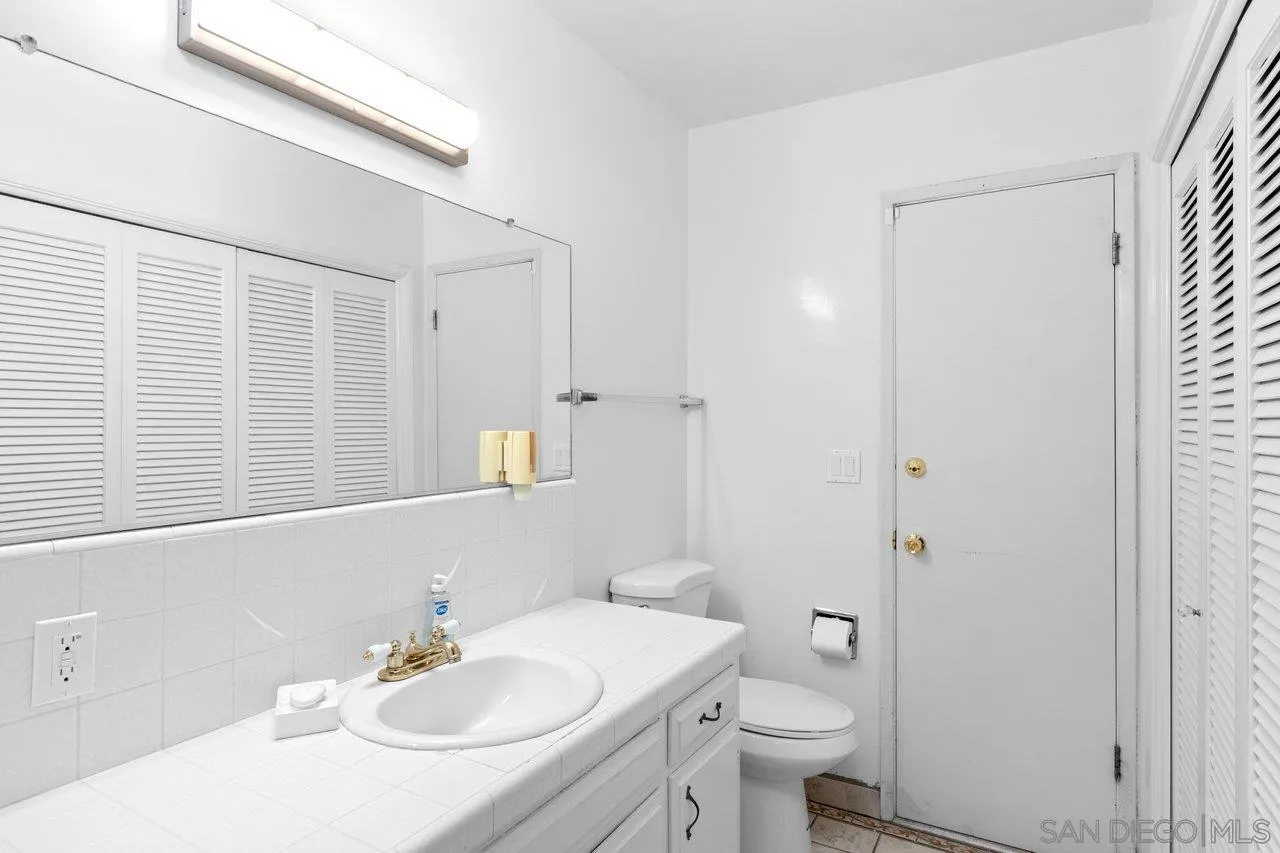 2169 Rockhoff Road Escondido, CA 92026 - Photo 21 of 22 a bathroom with a sink toilet and vanity