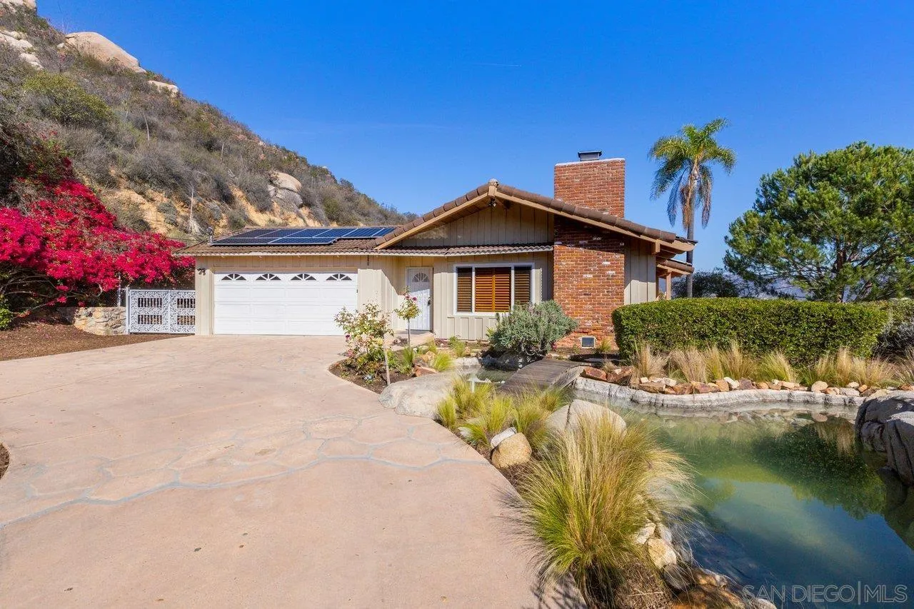 2169 Rockhoff Road Escondido, CA 92026 - Photo 4 of 22 a view of a house with pool and chairs