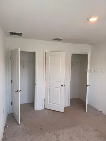 a bathroom with a sink double vanity and a shower