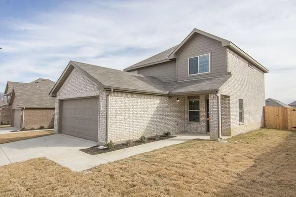 a view of a house with a snow in the background