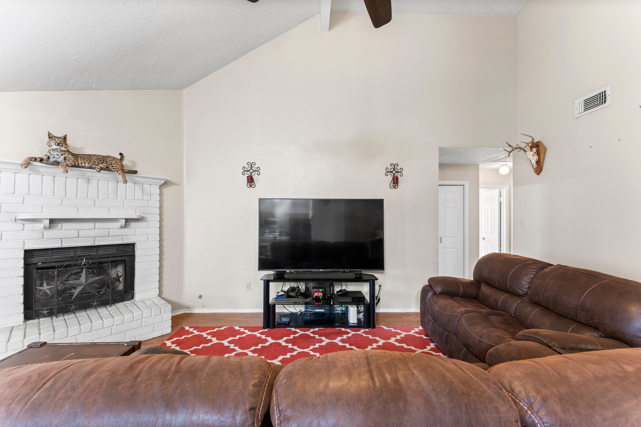 2110 Creston Drive Spring, TX 77386 - Photo 11 of 50 a bedroom with furniture and a fireplace