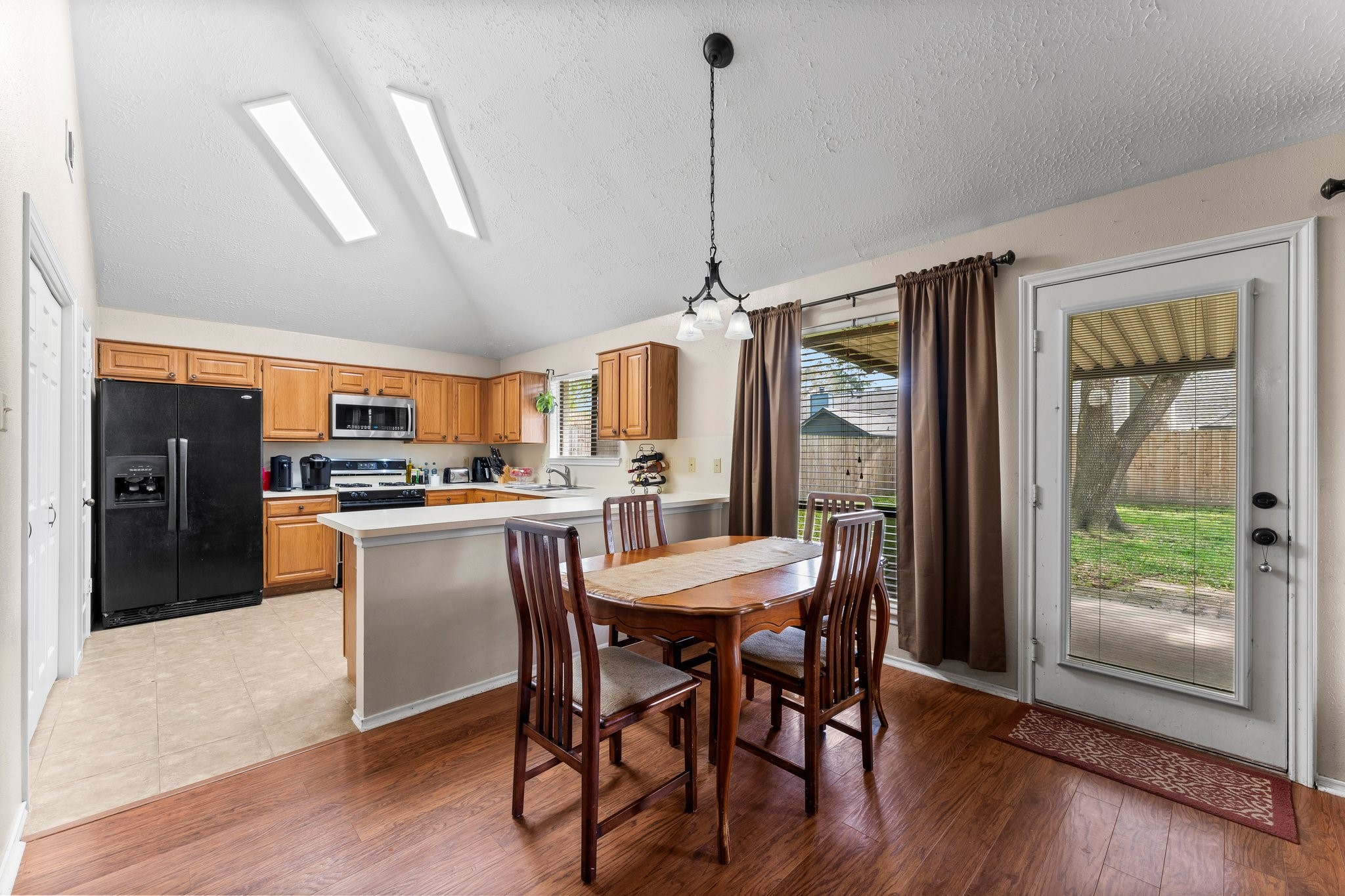 2110 Creston Drive Spring, TX 77386 - Photo 13 of 50 a view of a dining room with furniture window and wooden floor