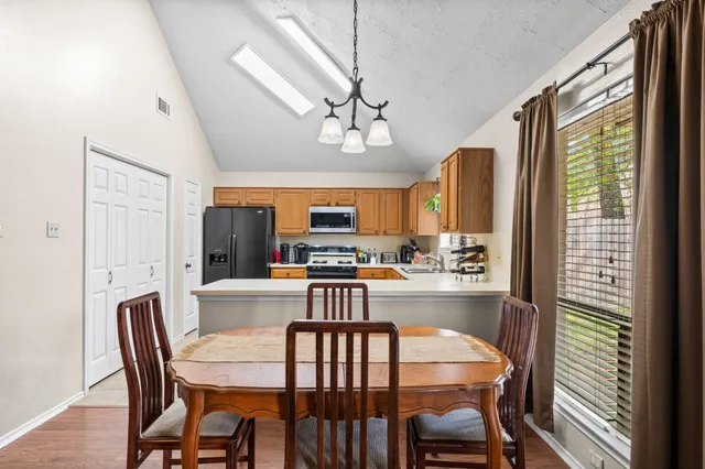 a view of a dining room with furniture window and wooden floor