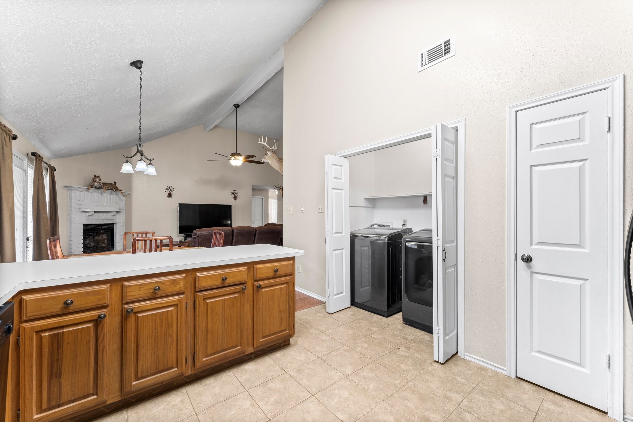 2110 Creston Drive Spring, TX 77386 - Photo 18 of 50 a large white kitchen with a sink a refrigerator and a stove
