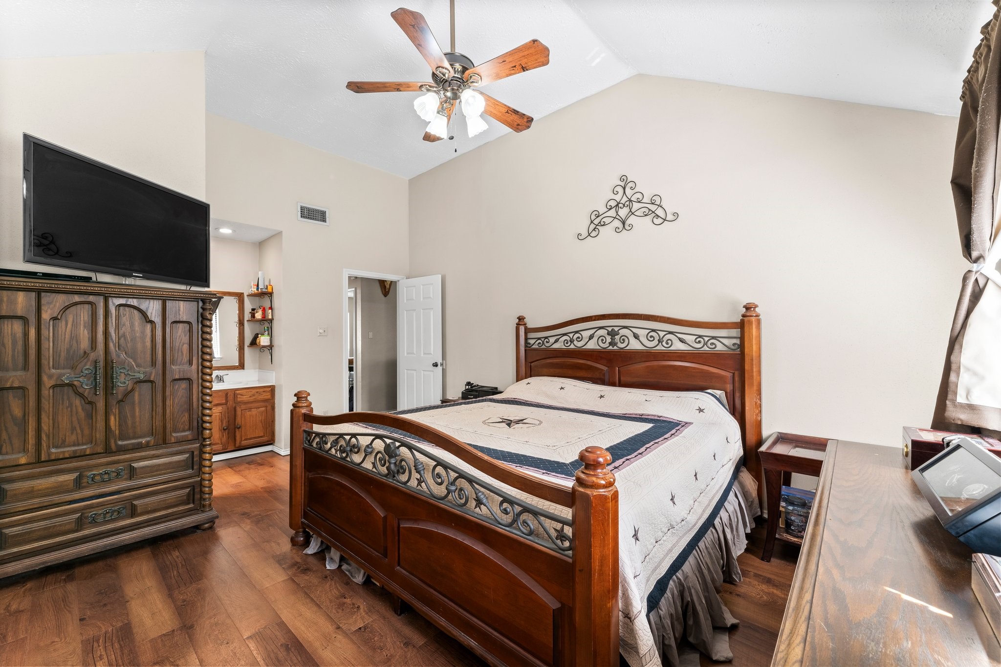2110 Creston Drive Spring, TX 77386 - Photo 22 of 50 a bedroom with a bed and a flat screen tv