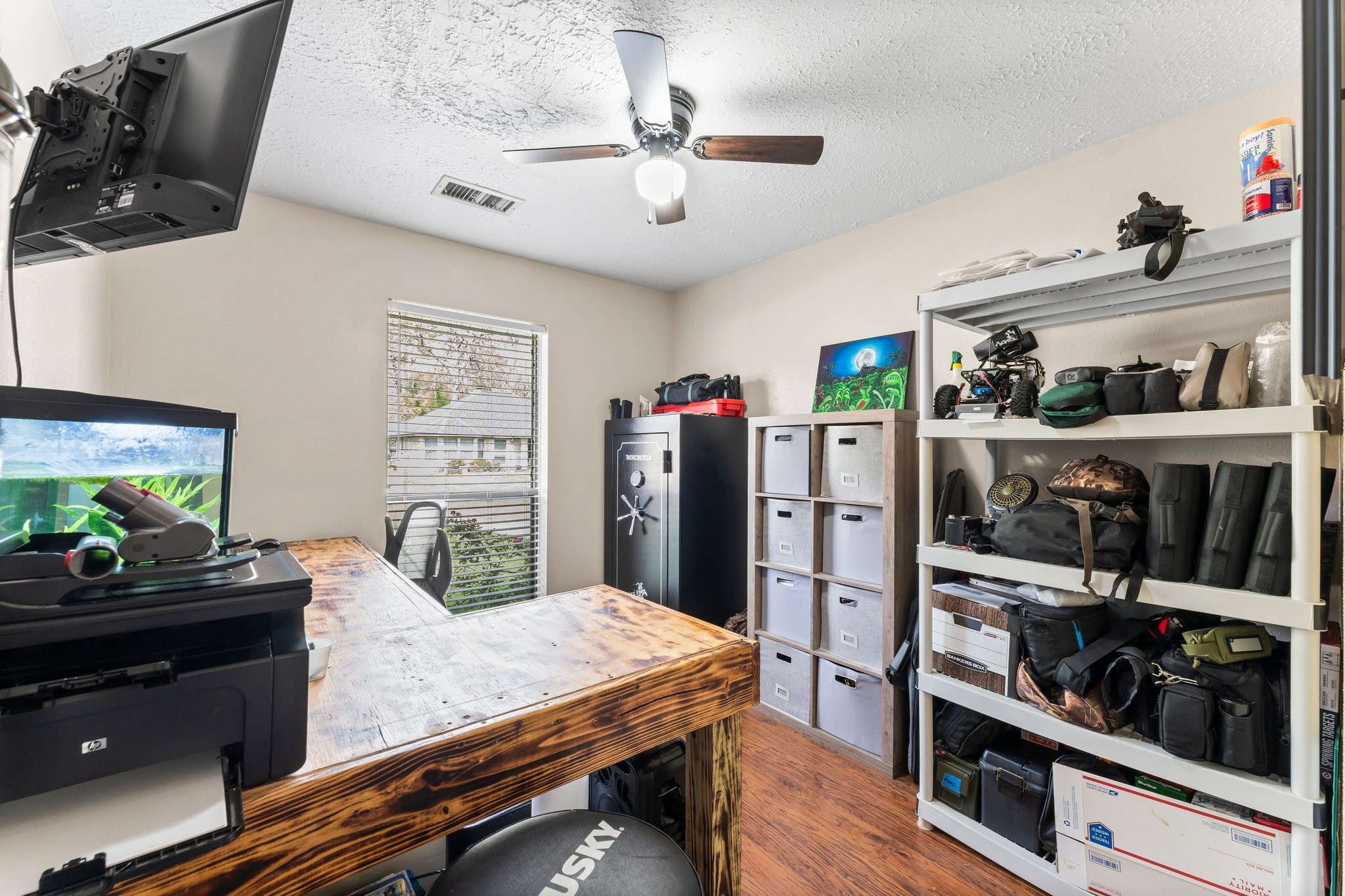 2110 Creston Drive Spring, TX 77386 - Photo 27 of 50 a kitchen with stainless steel appliances kitchen island granite countertop a refrigerator a stove and white cabinets with wooden floor
