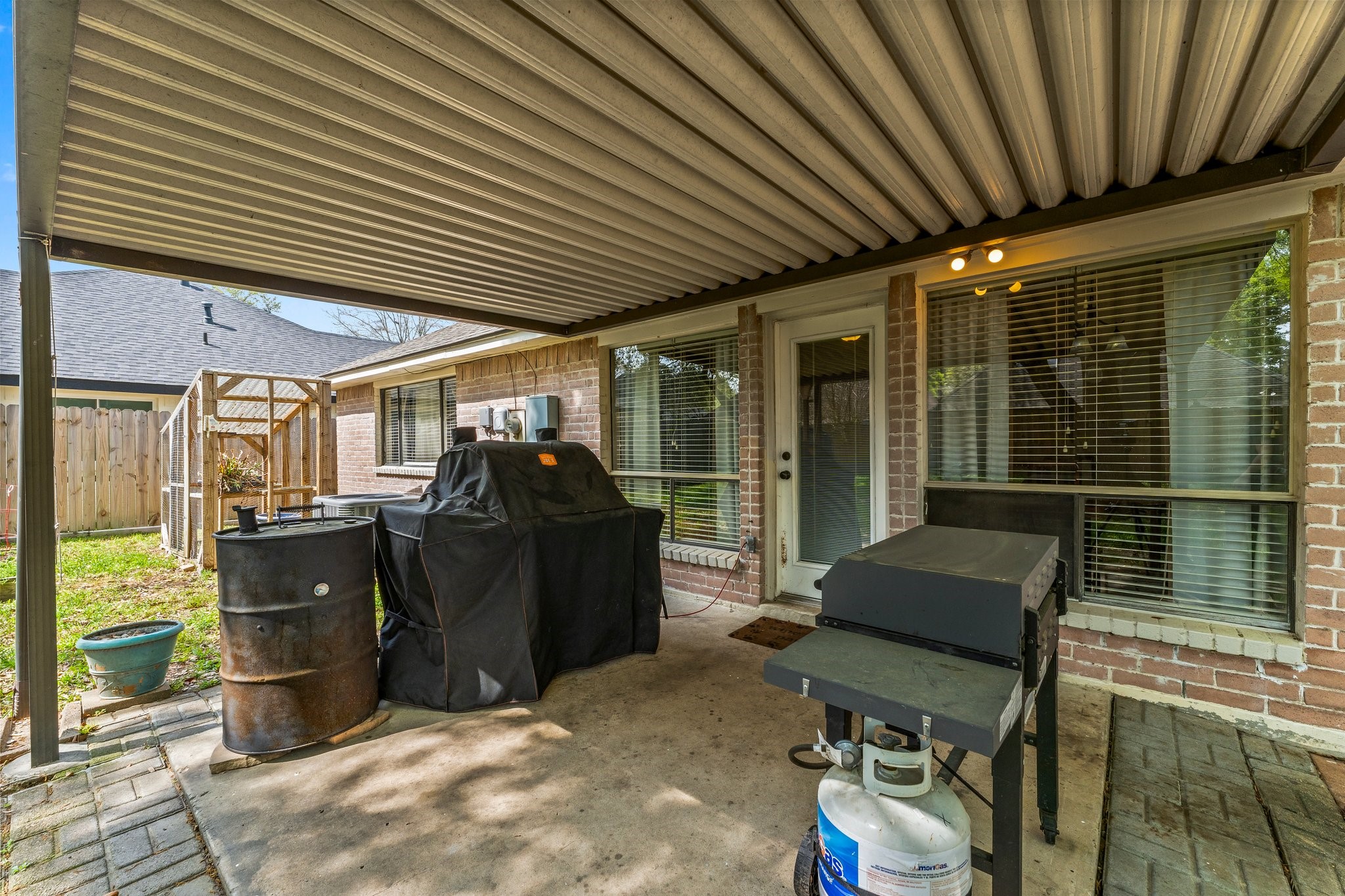 2110 Creston Drive Spring, TX 77386 - Photo 30 of 50 a view of a chairs and table in a patio