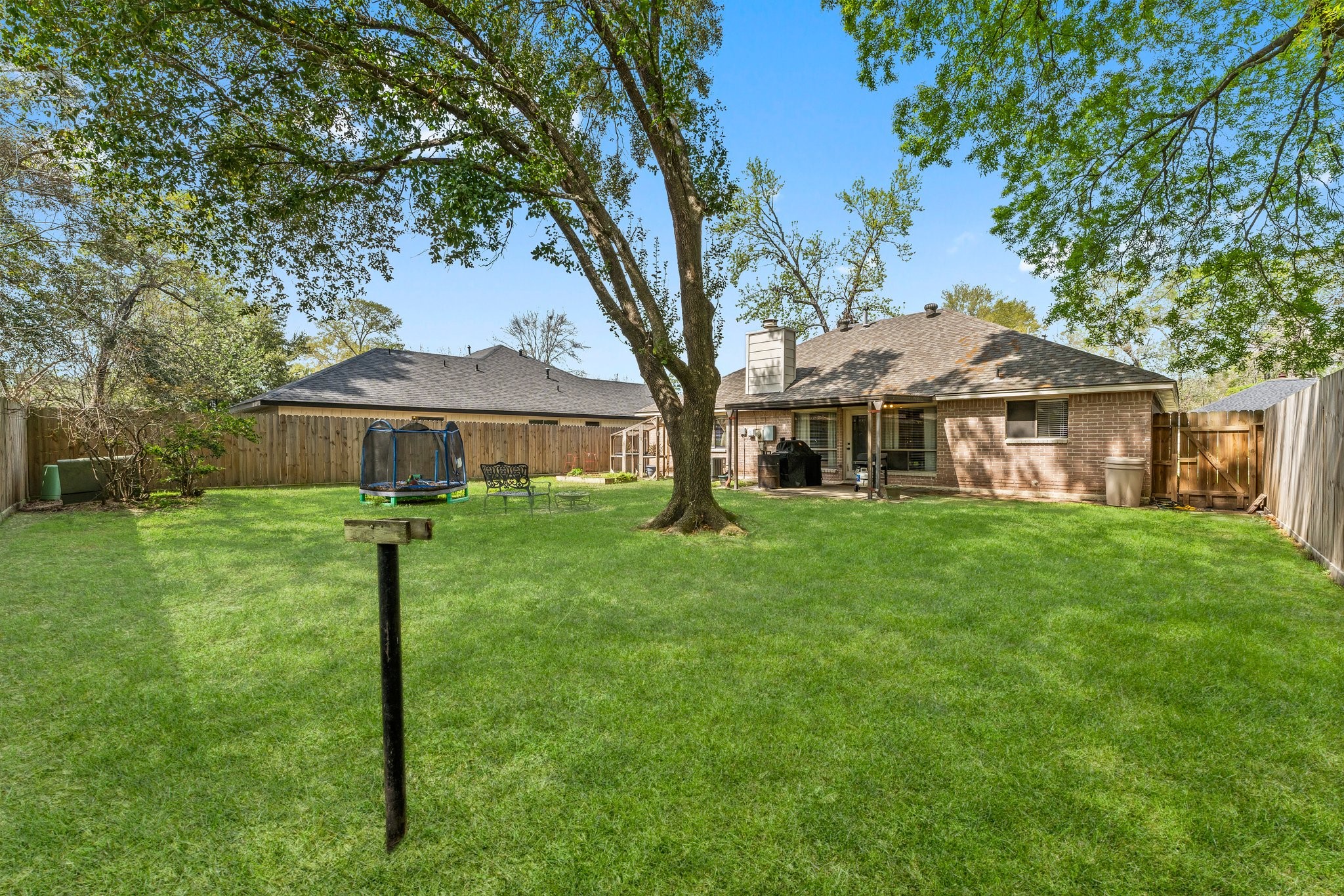 2110 Creston Drive Spring, TX 77386 - Photo 32 of 50 a front view of a house with a yard and trees
