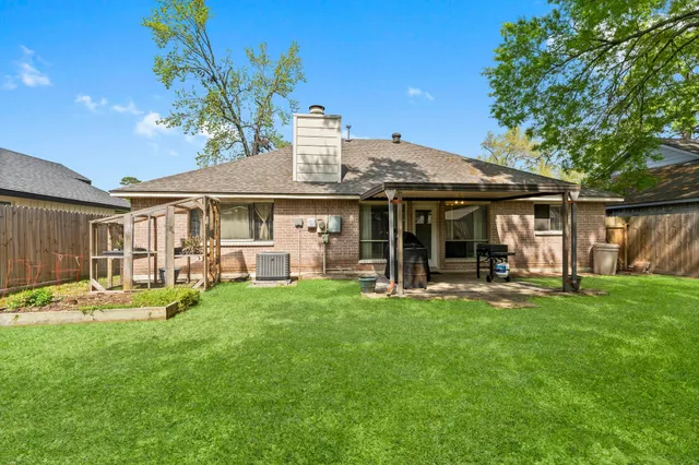 a view of a house with a backyard porch and sitting area