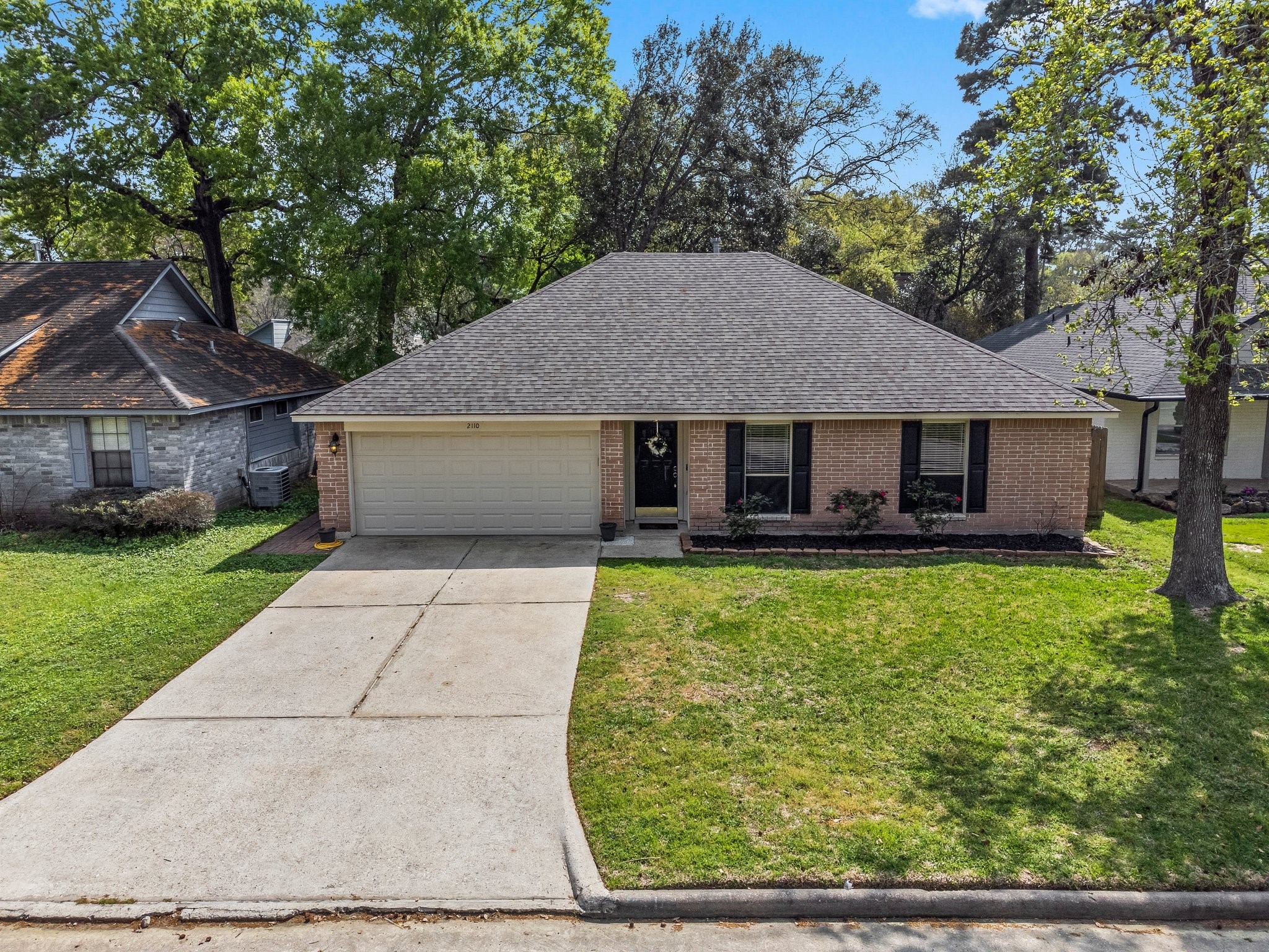 2110 Creston Drive Spring, TX 77386 - Photo 40 of 50 a front view of a house with garden