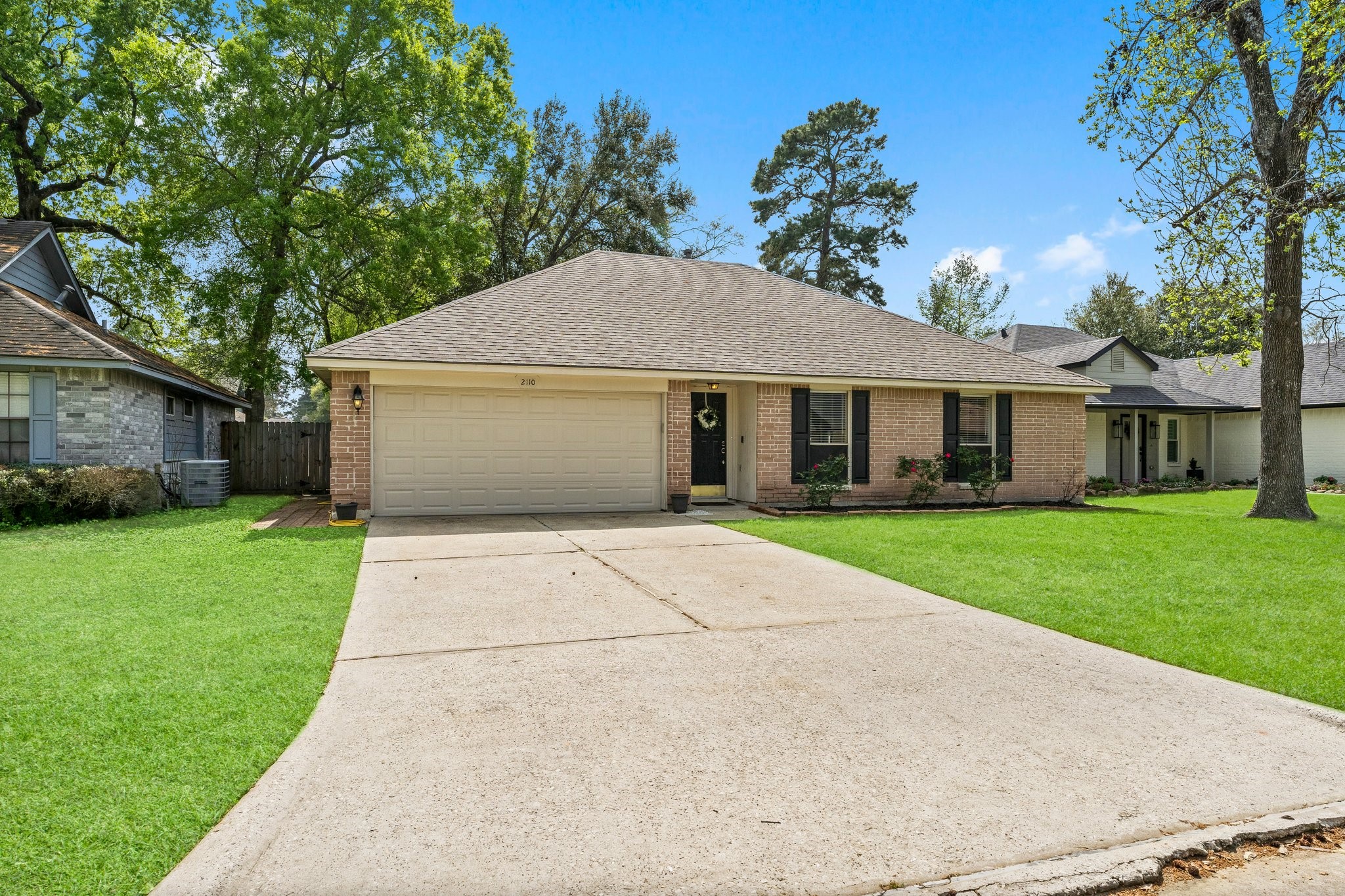 2110 Creston Drive Spring, TX 77386 - Photo 4 of 50 a front view of a house with a yard