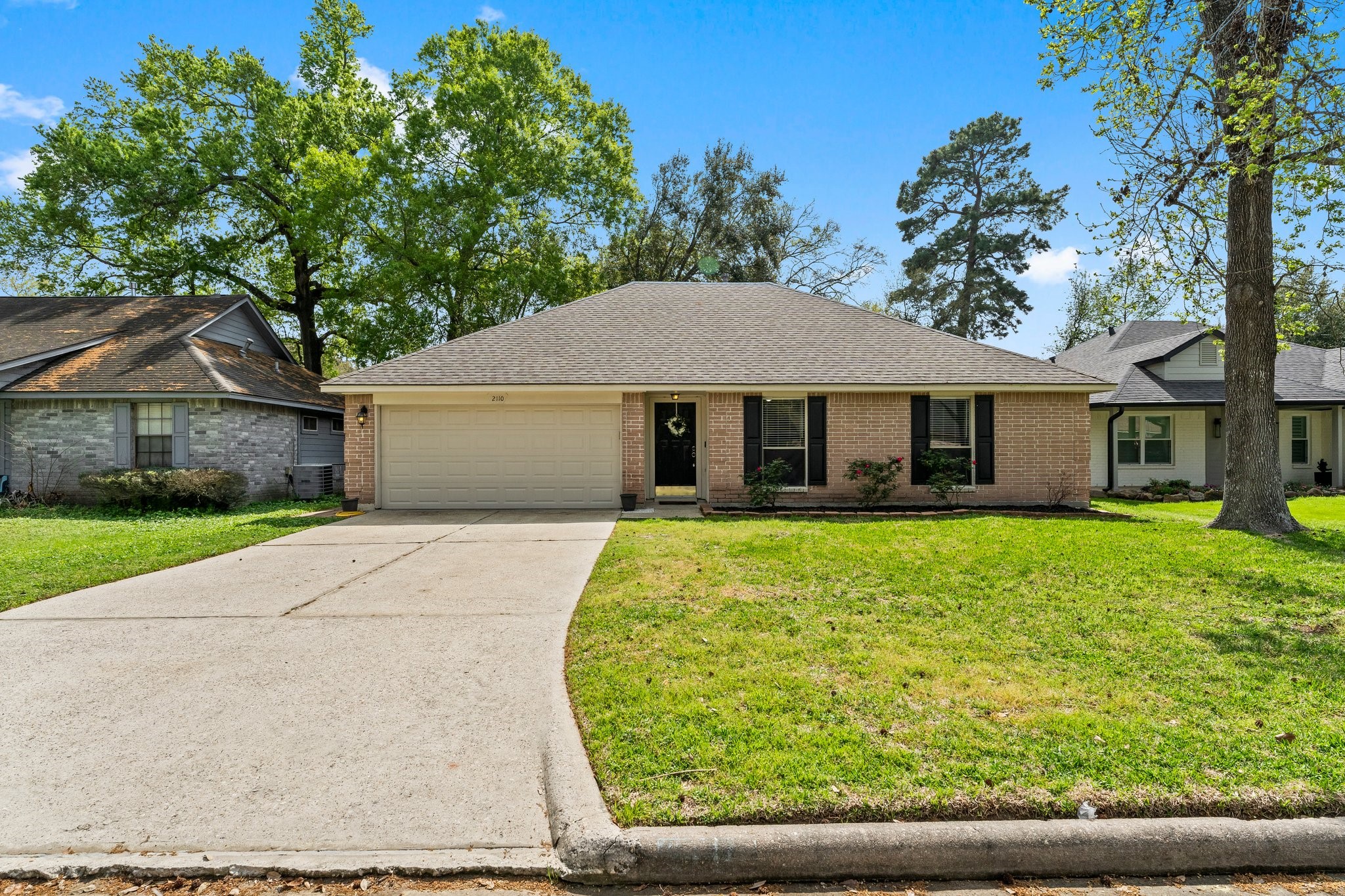 2110 Creston Drive Spring, TX 77386 - Photo 42 of 50 front view of a house with a yard