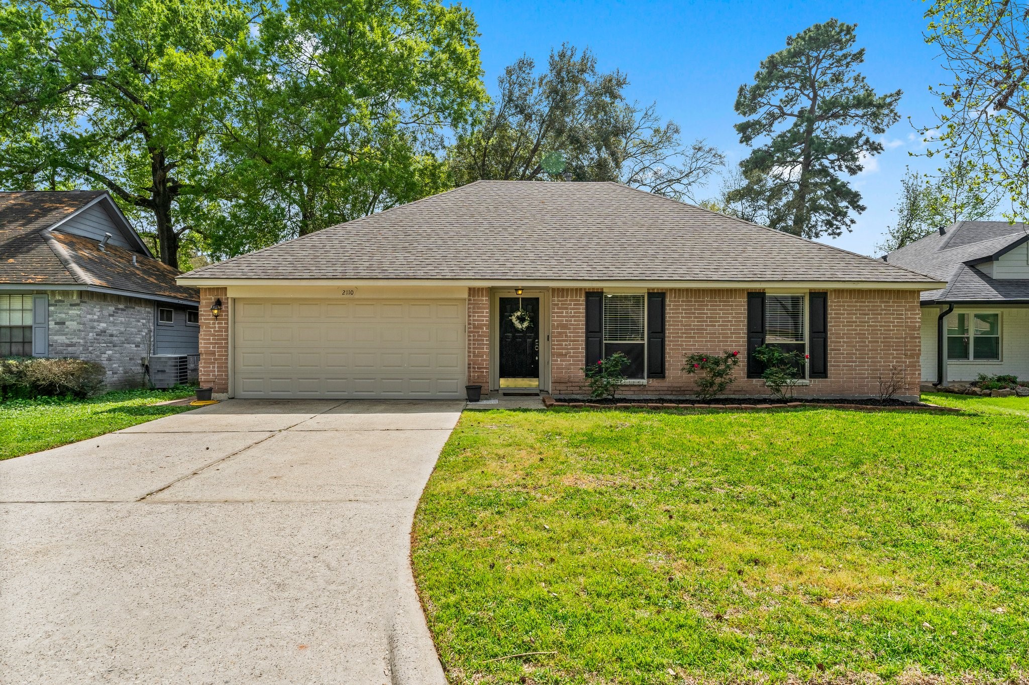 2110 Creston Drive Spring, TX 77386 - Photo 43 of 50 front view of a house with a yard