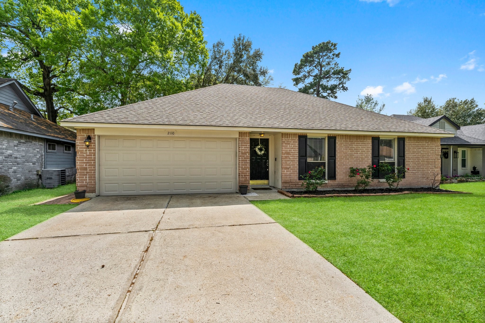 2110 Creston Drive Spring, TX 77386 - Photo 5 of 50 a front view of house with yard and green space