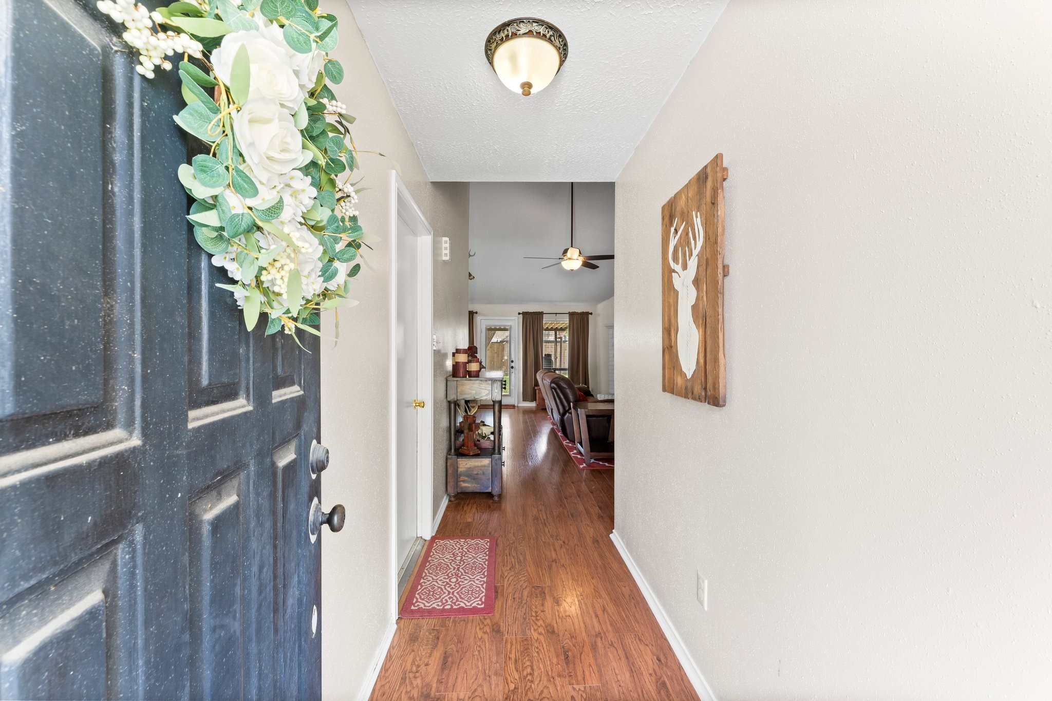 2110 Creston Drive Spring, TX 77386 - Photo 7 of 50 a view of a hallway with wooden floor and front door