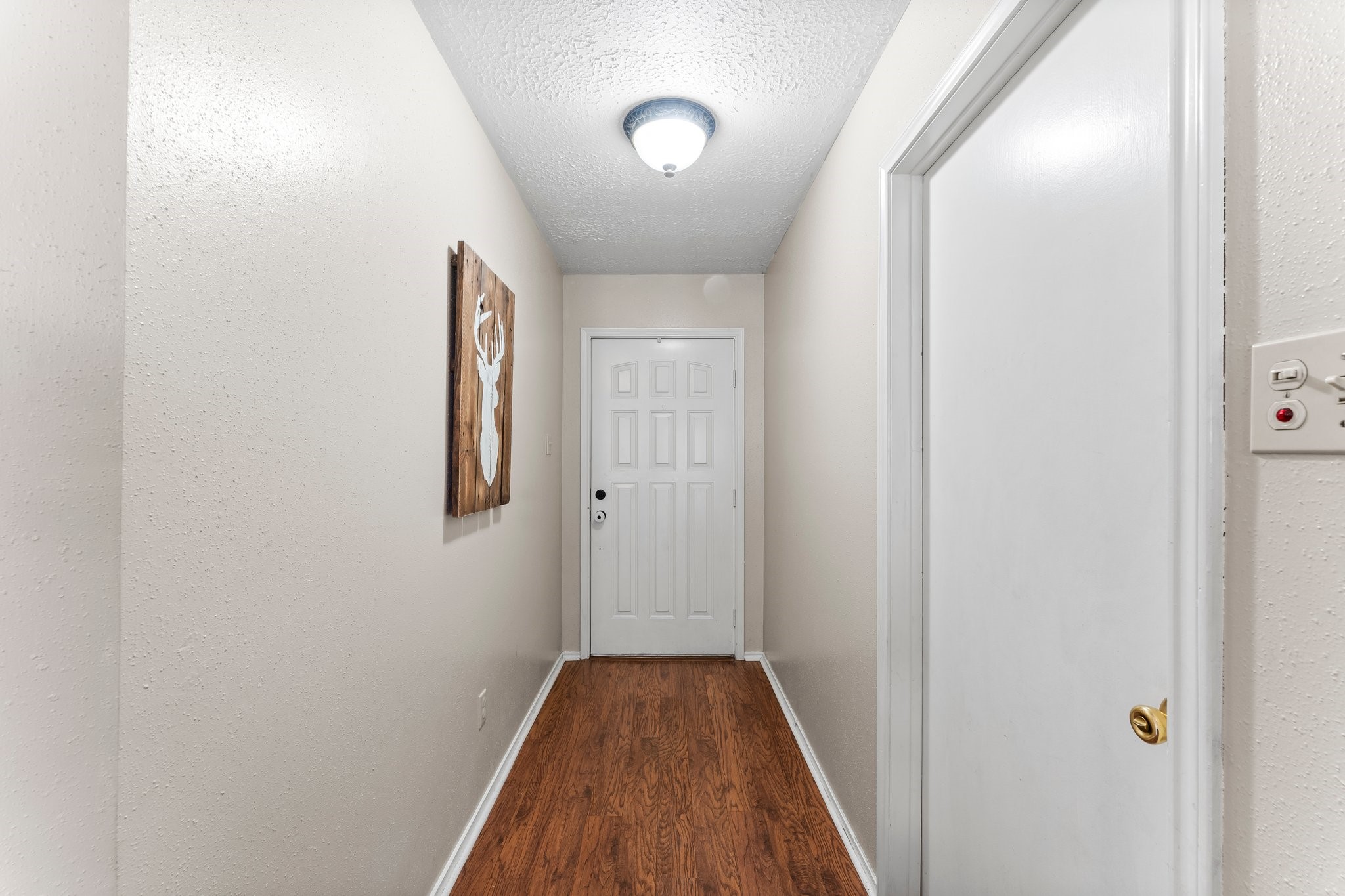 2110 Creston Drive Spring, TX 77386 - Photo 8 of 50 a view of a hallway with wooden floor