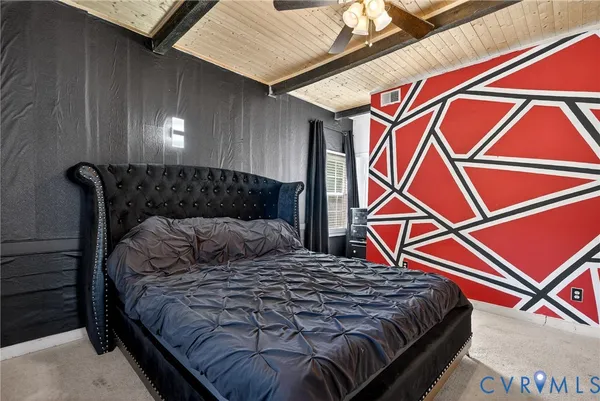 a bedroom with a bed and a lamp