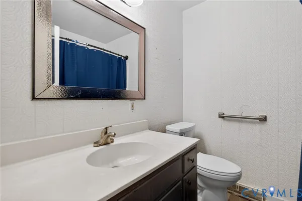 a bathroom with a sink and a toilet