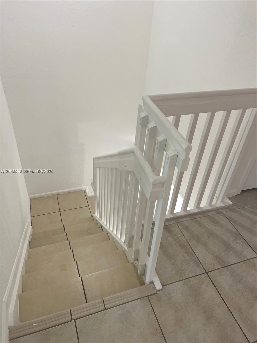 2910 Southeast 15th Road, Unit 55 Homestead, FL 33035 - Photo 13 of 13 a view of a livingroom with wooden floor and entryway