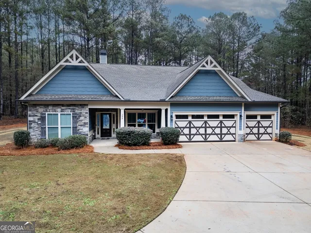 a front view of a house with yard patio and porch