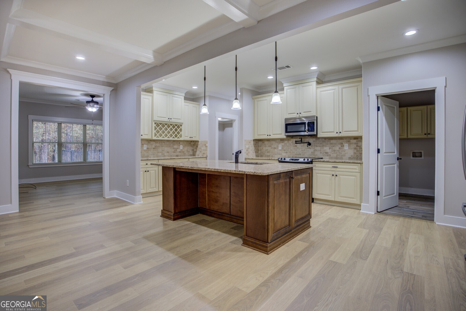 284 Sowell Road McDonough, GA 30252 - Photo 11 of 48 a kitchen with kitchen island a sink stainless steel appliances and cabinets