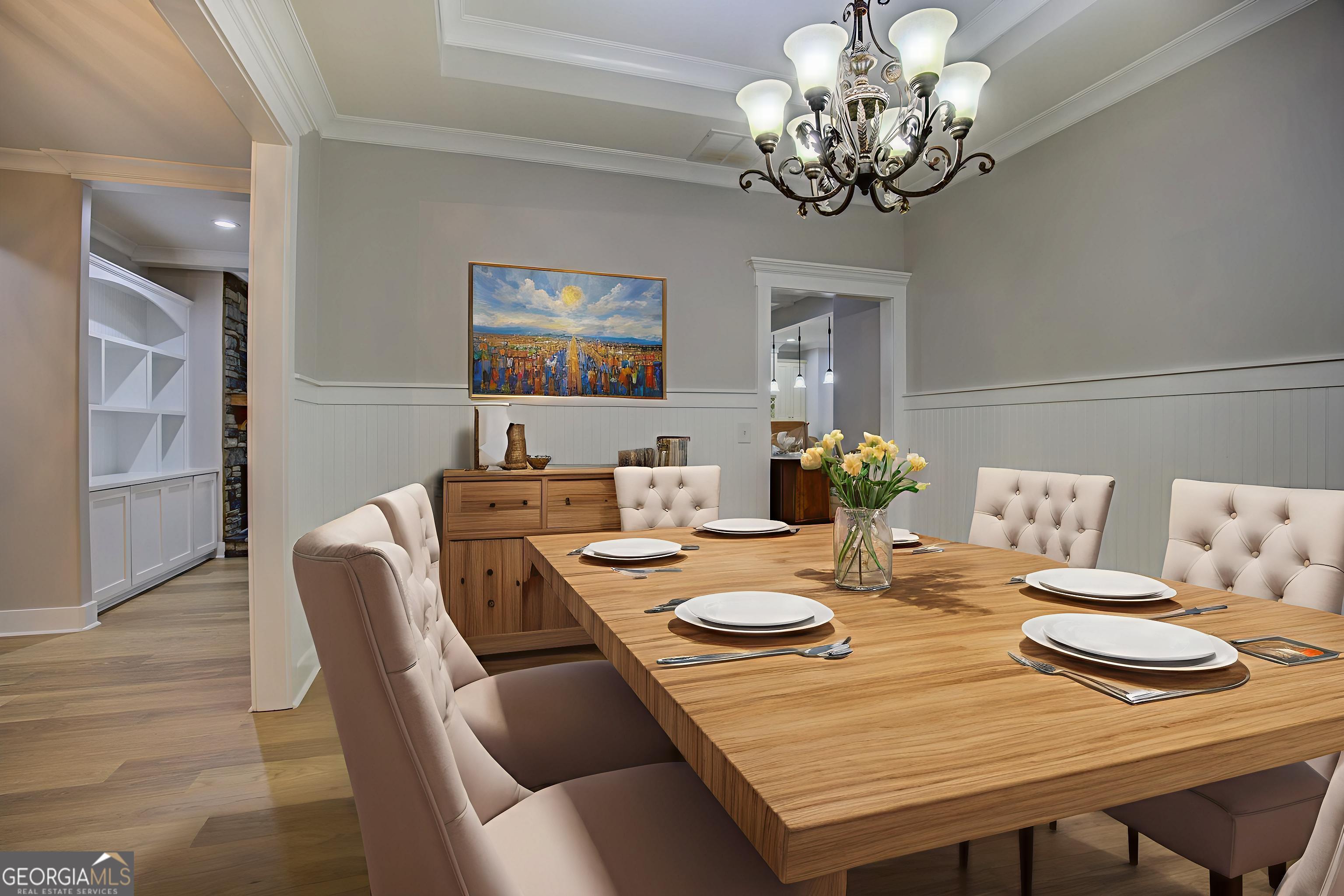 284 Sowell Road McDonough, GA 30252 - Photo 21 of 48 a view of a dining room with furniture a chandelier and wooden floor