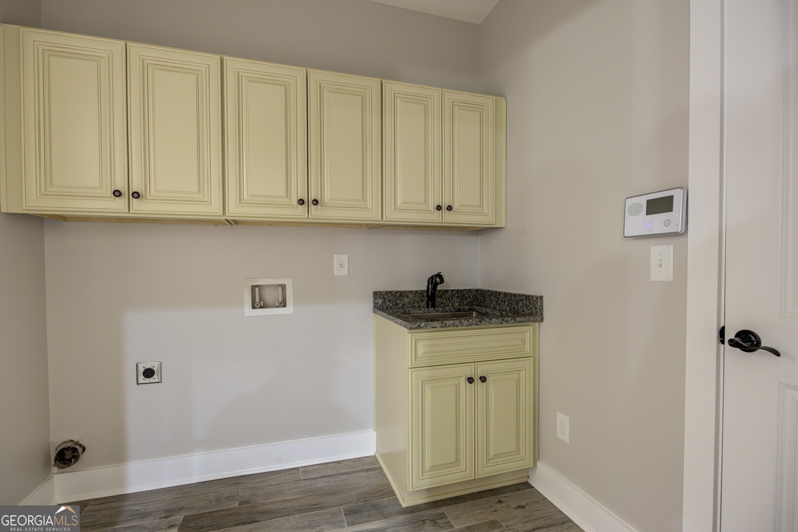 284 Sowell Road McDonough, GA 30252 - Photo 26 of 48 a kitchen with granite countertop white cabinets and a sink