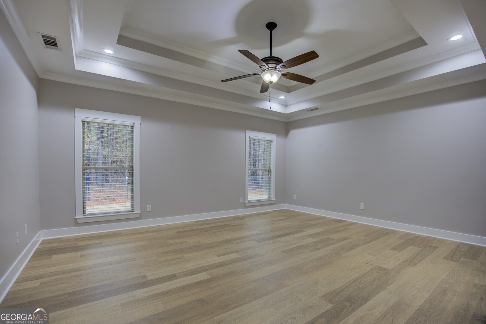 284 Sowell Road McDonough, GA 30252 - Photo 29 of 48 a view of an empty room with wooden floor and a window