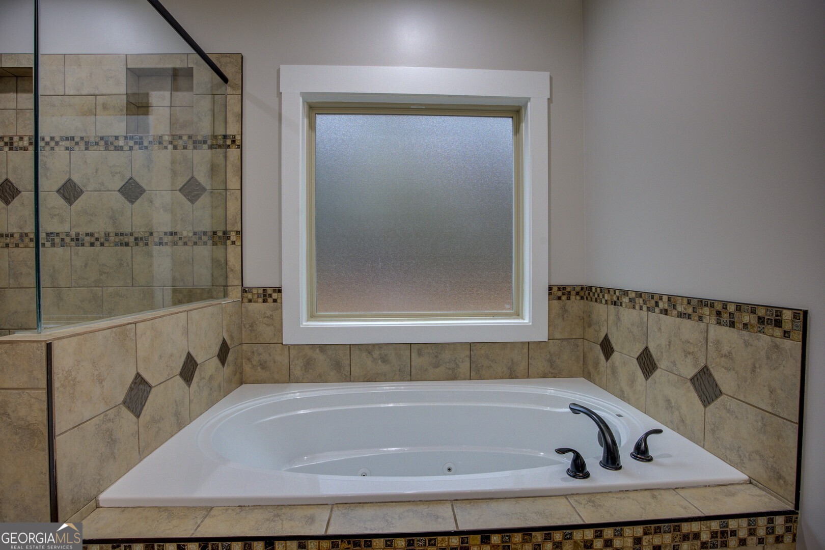 284 Sowell Road McDonough, GA 30252 - Photo 33 of 48 a bathroom with a bath tub and shower