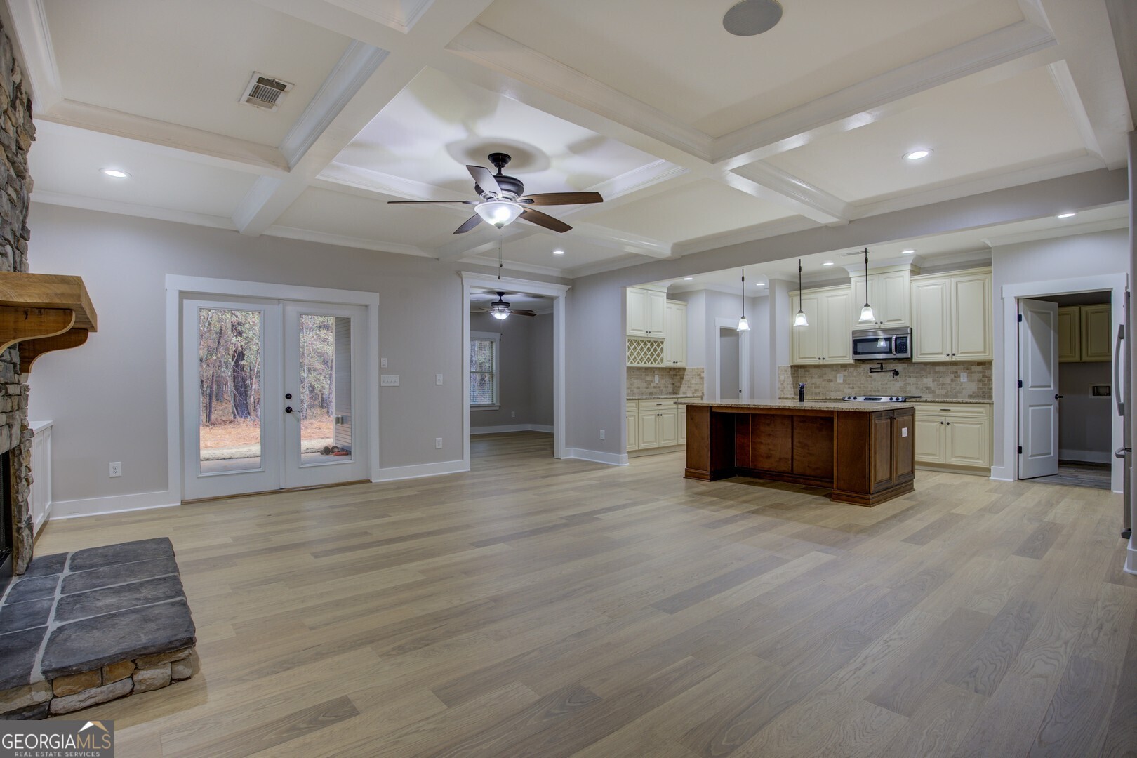 284 Sowell Road McDonough, GA 30252 - Photo 5 of 48 a large kitchen with stainless steel appliances kitchen island granite countertop a stove and a wooden floors