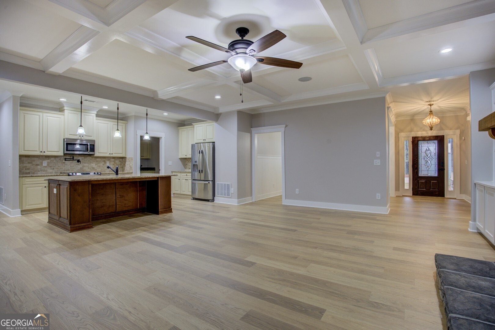 284 Sowell Road McDonough, GA 30252 - Photo 6 of 48 a view of a kitchen with a sink and a ceiling fan