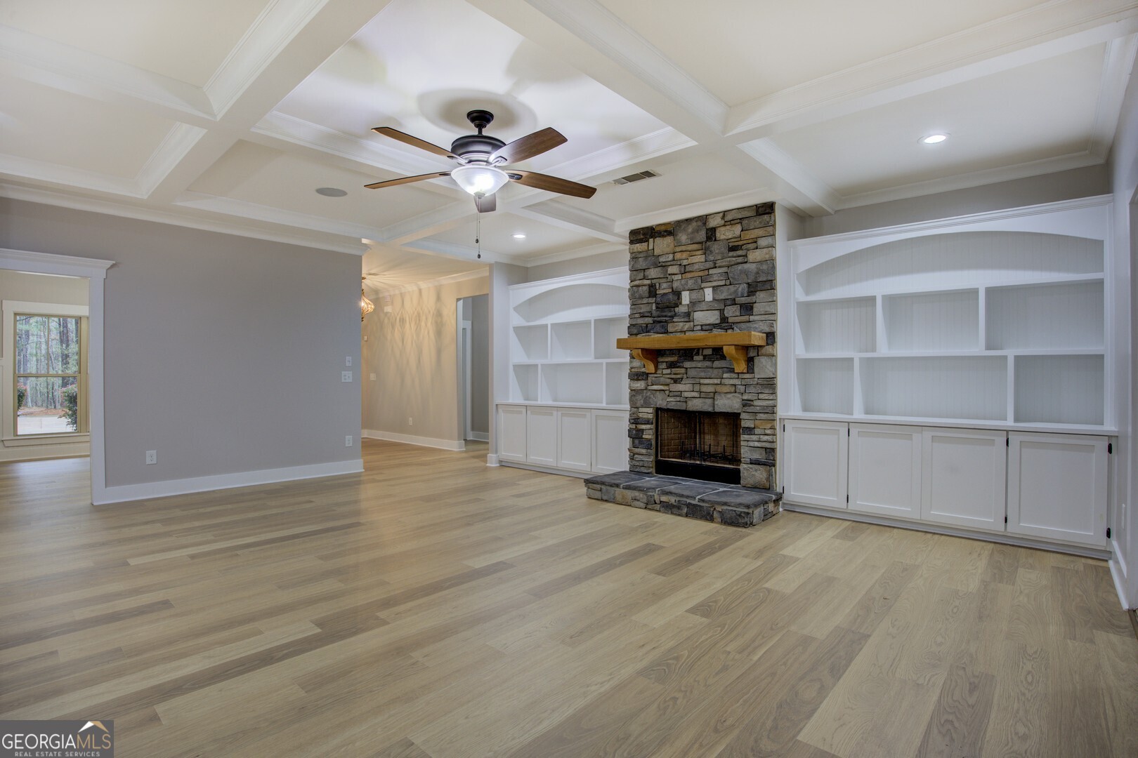 284 Sowell Road McDonough, GA 30252 - Photo 8 of 48 a view of an empty room with a fireplace and a window