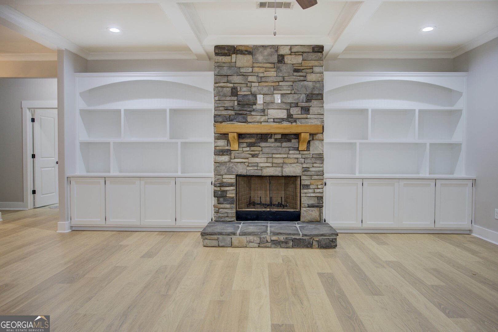 284 Sowell Road McDonough, GA 30252 - Photo 9 of 48 a living room with a fireplace and a wooden floor