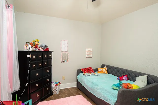 a bed room with a bed and a dresser