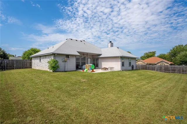 a front view of a house with a garden and porch