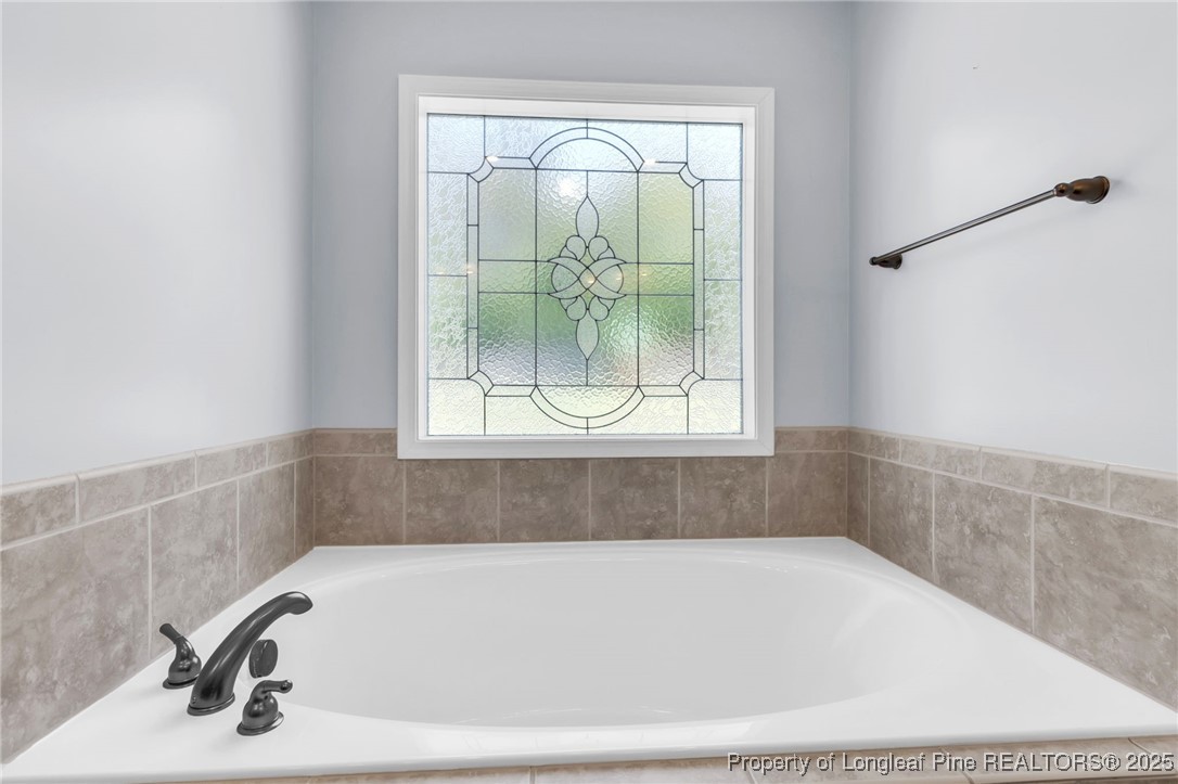510 Hammond Farms Road Hope Mills, NC 28348 - Photo 19 of 49 a bathroom with a bathtub