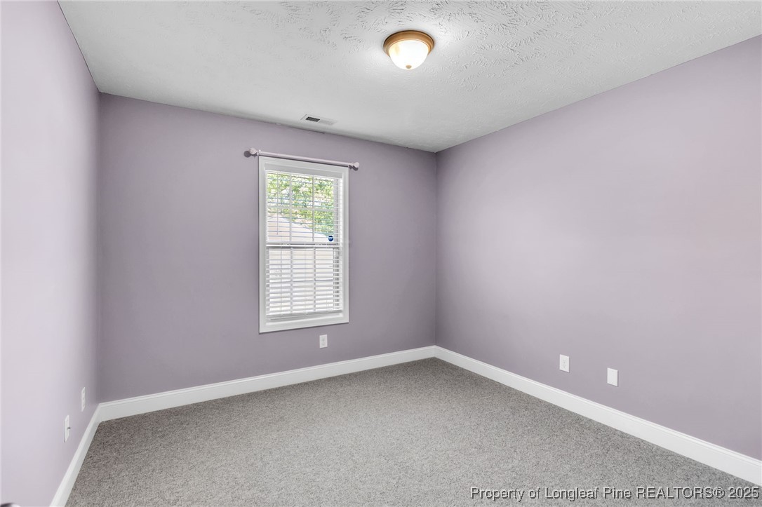 510 Hammond Farms Road Hope Mills, NC 28348 - Photo 27 of 49 an empty room with a window