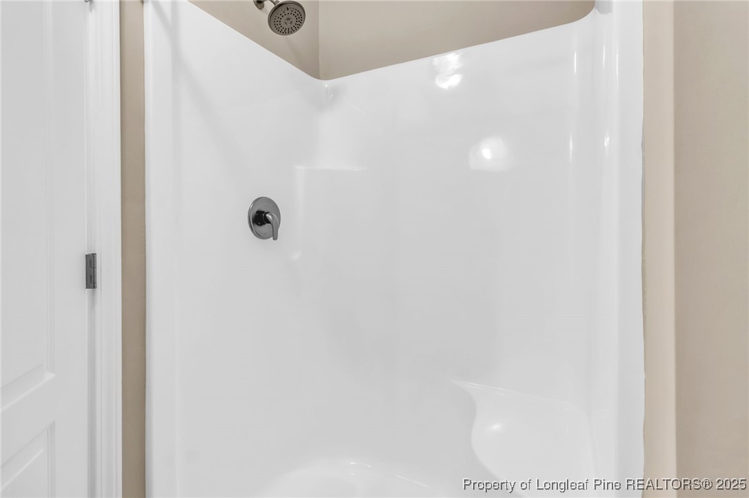 510 Hammond Farms Road Hope Mills, NC 28348 - Photo 34 of 49 a bathroom with a tub