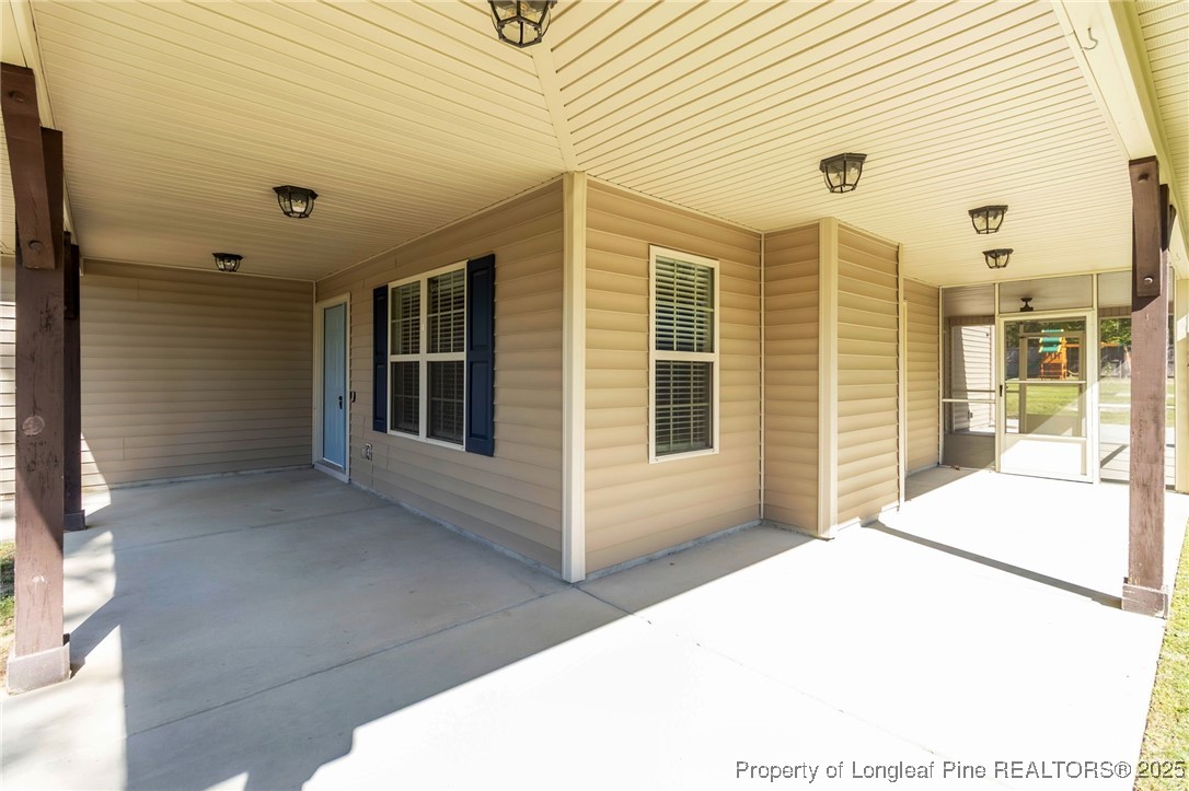 510 Hammond Farms Road Hope Mills, NC 28348 - Photo 4 of 49 a view of a porch with patio