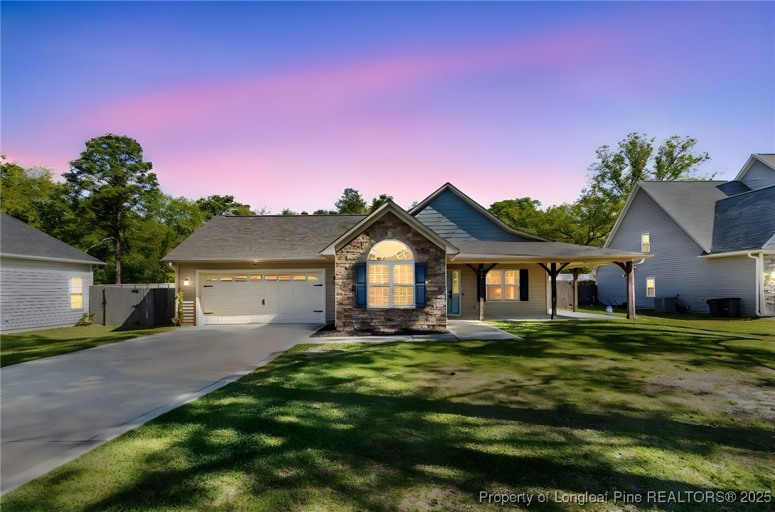 510 Hammond Farms Road Hope Mills, NC 28348 - Photo 46 of 49 a front view of a house with a yard