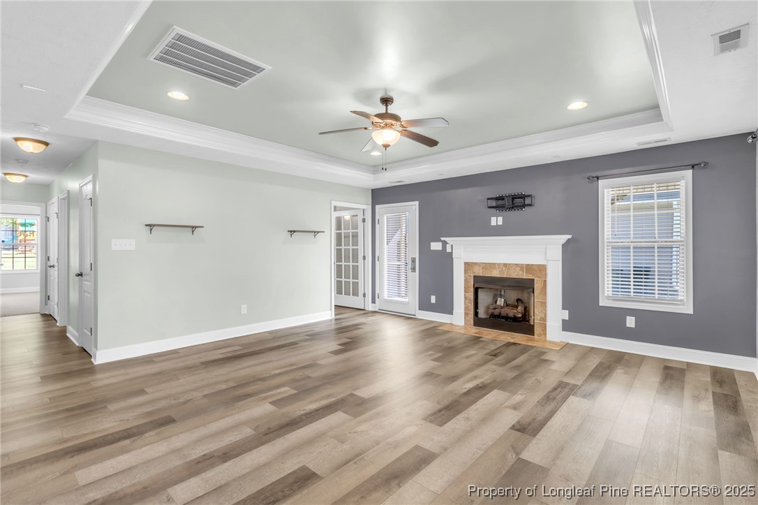 510 Hammond Farms Road Hope Mills, NC 28348 - Photo 6 of 49 a view of an empty room with wooden floor fireplace and a window